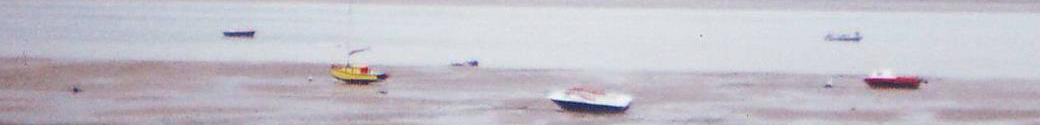 Photograph of boats at low tide at Lytham